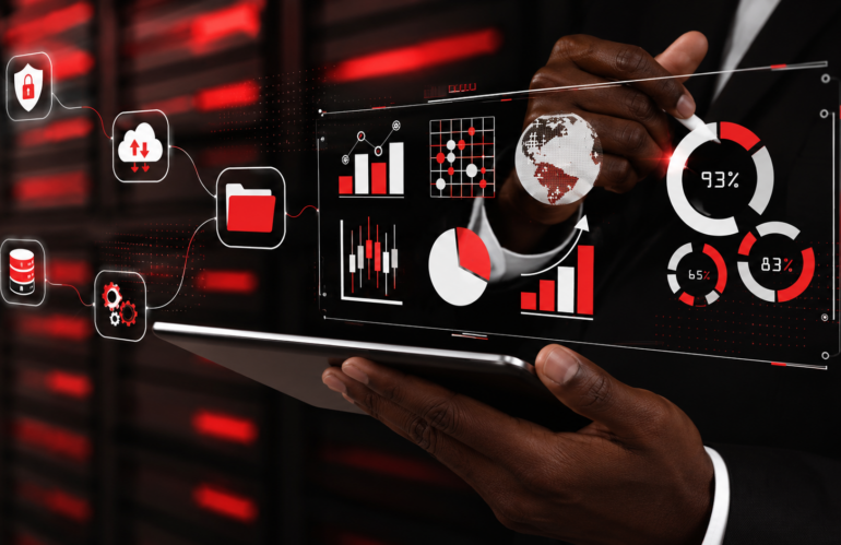 Homme noir utilisant une tablette tactile avec une interface numérique de sauvegarde et de gestion des données, illustrant les solutions de sauvegarde sécurisée pour les PME dans un environnement informatique moderne.